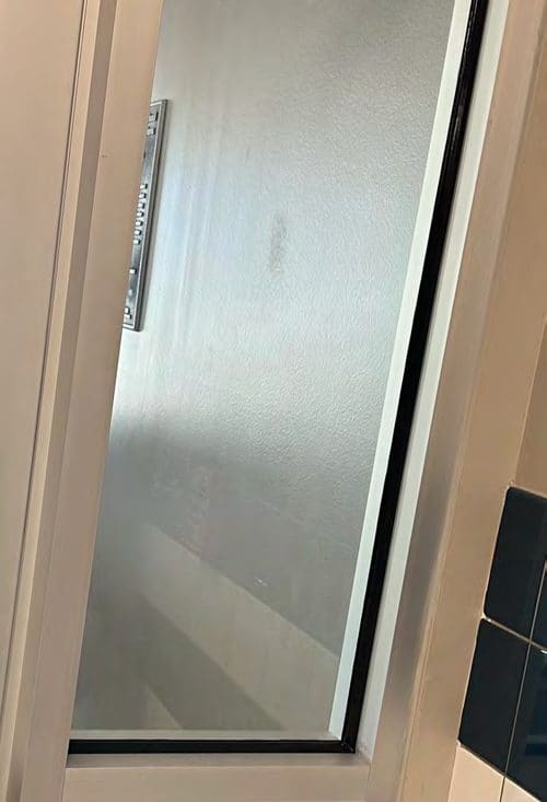 Correct security film installation by Epic: Continuous bead, hardware removed and reinstalled.