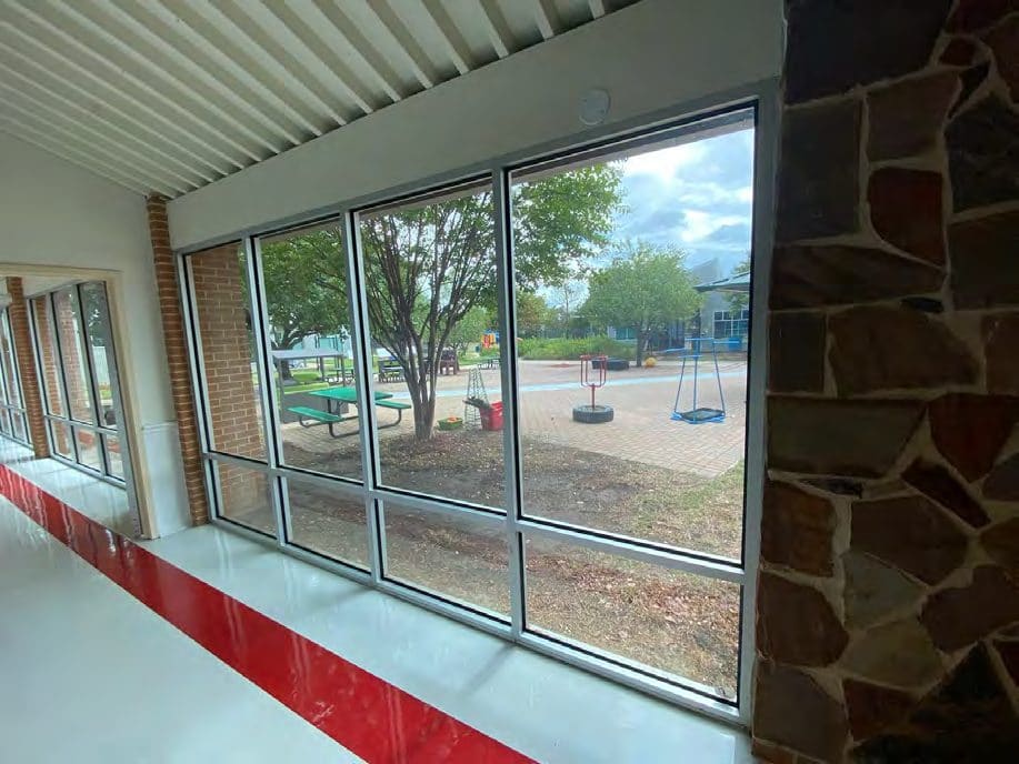 Correct security film installation by Epic: Classroom glass, filmed to the edge.