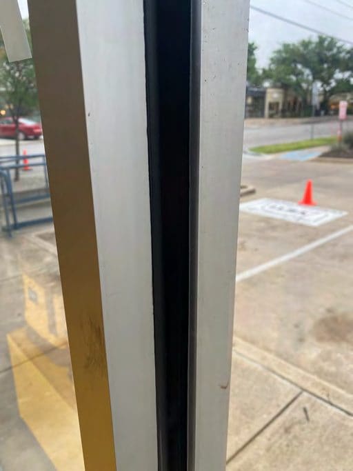 Correct security film installation by Epic: Vestibule door, uniform bead.
