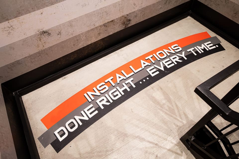 Floor decal at a stair landing reading "Installations done right … every time."