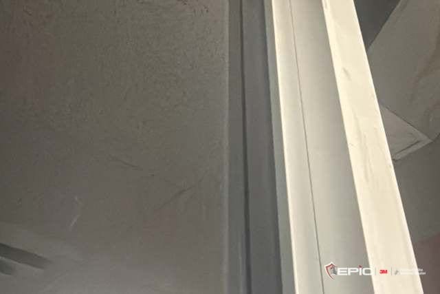 Attachment bead running down a window mullion at a Dallas ISD school, seen from below