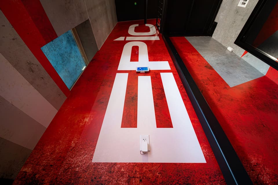 Red and white EPIC floor graphic on a stair landing