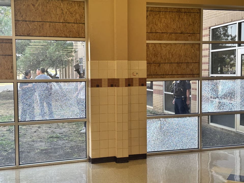 Godley ISD entry glass after a windstorm — shattered and held in place by 3M security film installed by Epic