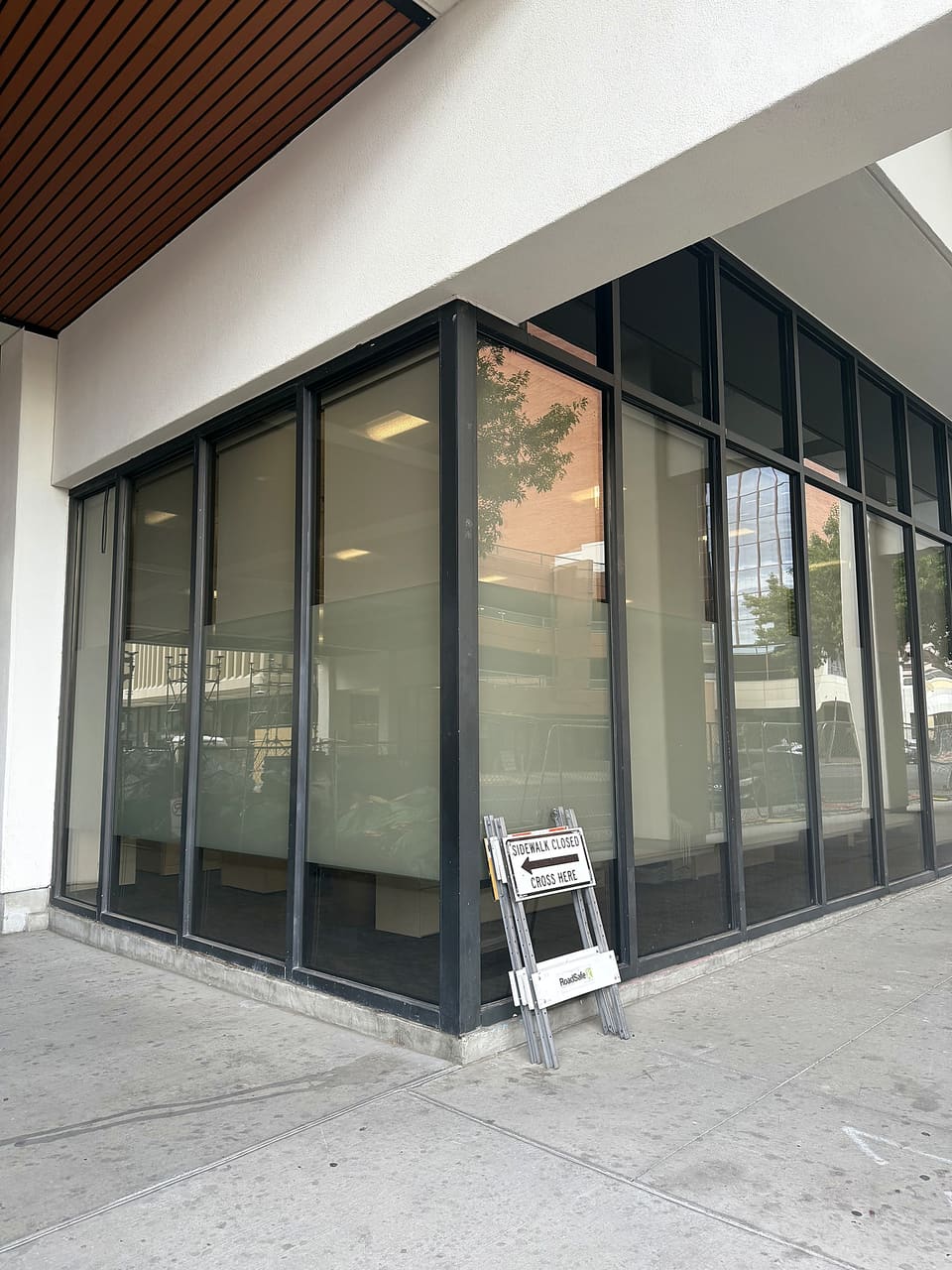 Street-level glass on a county government building in Albuquerque — blast and forced-entry film with a printed frost band, installed by Epic