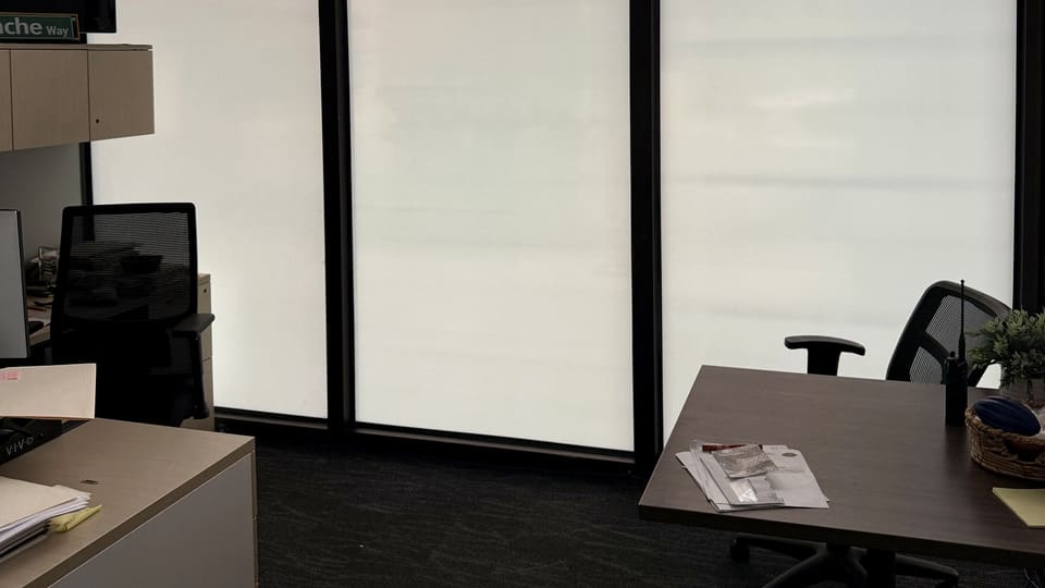 Custom-printed frost band applied over 3M security film at a county building in Albuquerque