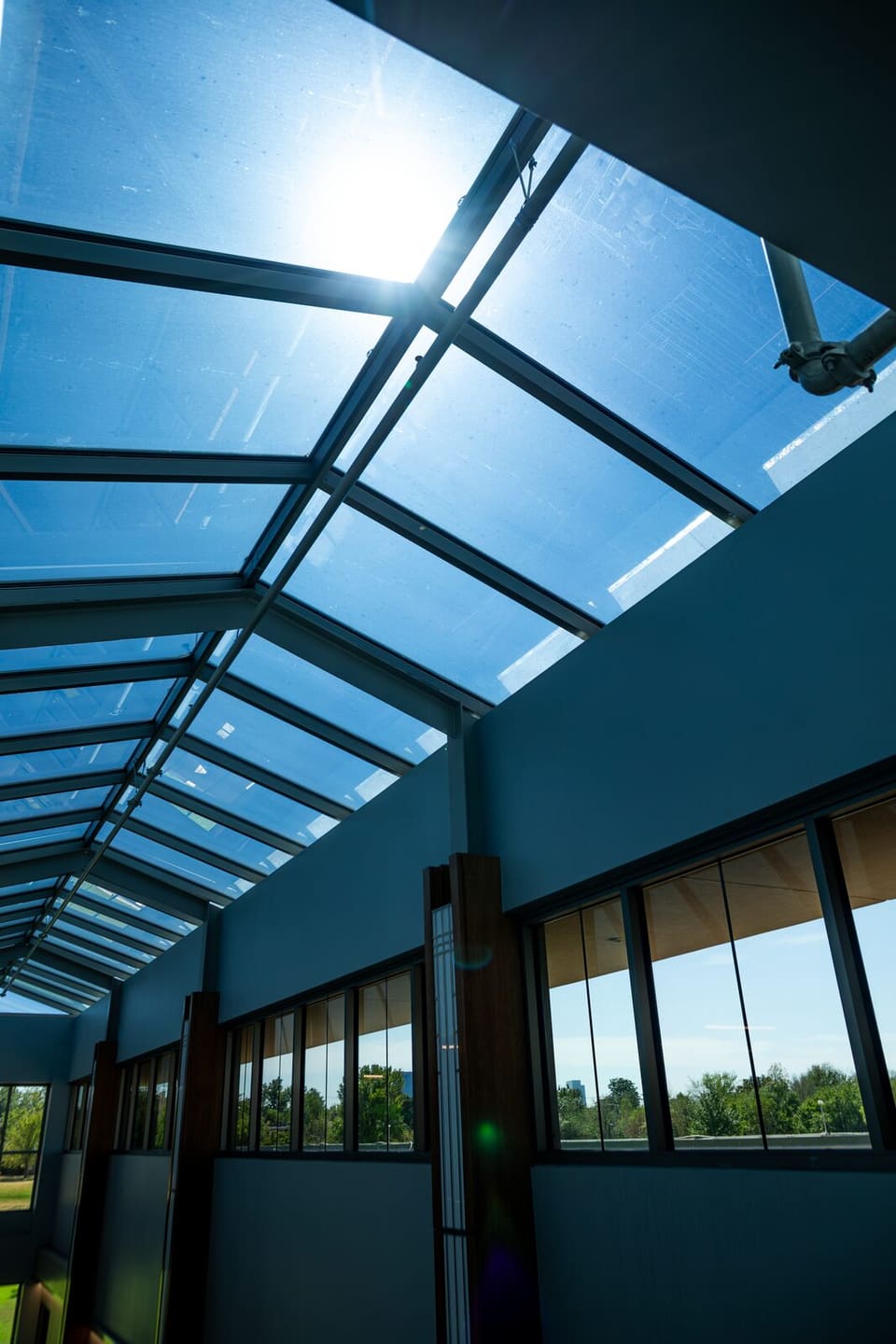 Completed atrium at the Oklahoma Department of Wildlife Conservation with Prestige on the glass and the skylight overhead