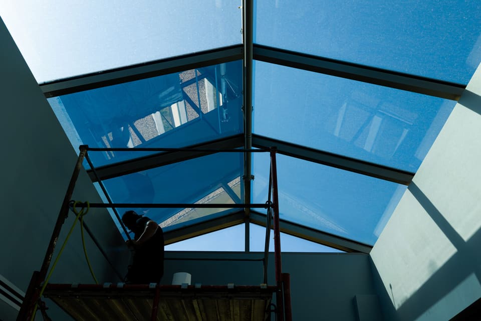 Epic crew working on the atrium glass and skylight at the Oklahoma Department of Wildlife Conservation during the film install