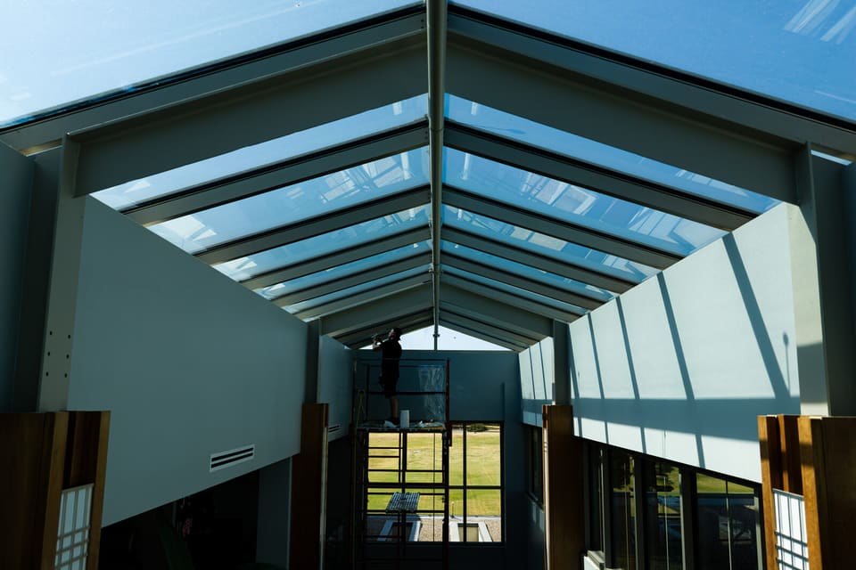 Epic crew working on the atrium glass and skylight at the Oklahoma Department of Wildlife Conservation during the film install