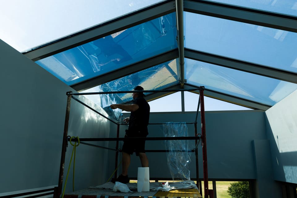 Epic crew working on the atrium glass and skylight at the Oklahoma Department of Wildlife Conservation during the film install
