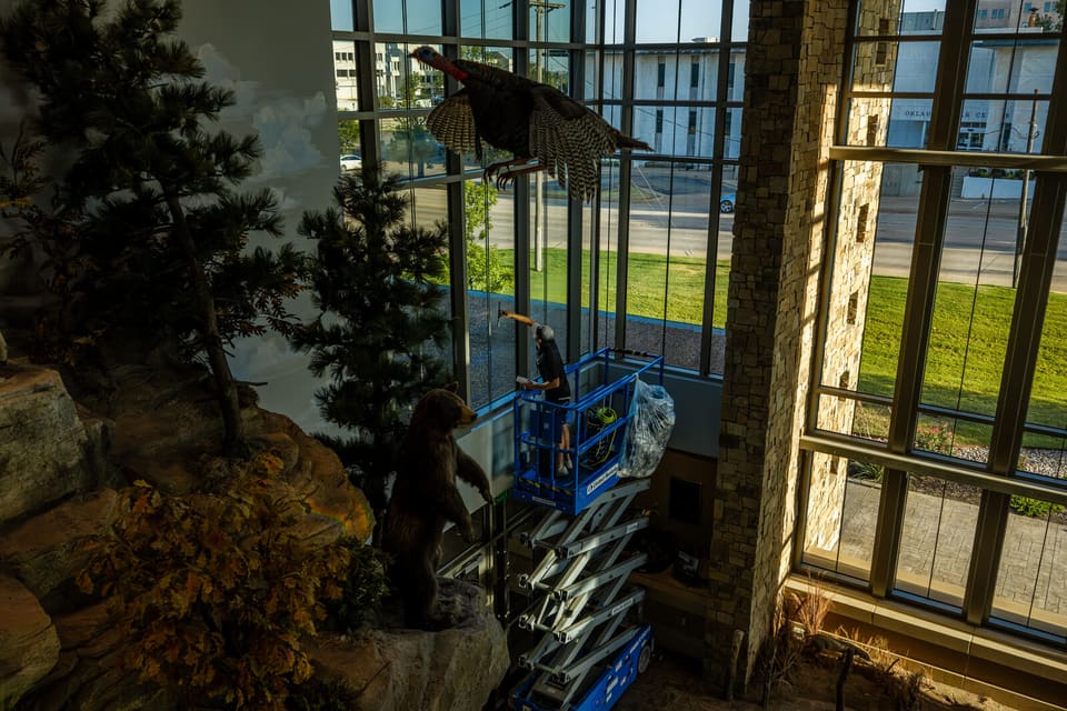 Epic crew working on the atrium glass and skylight at the Oklahoma Department of Wildlife Conservation during the film install
