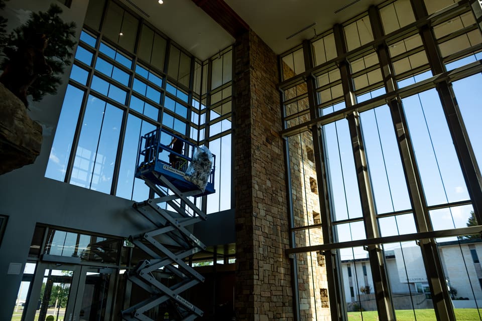 Epic crew working on the atrium glass and skylight at the Oklahoma Department of Wildlife Conservation during the film install