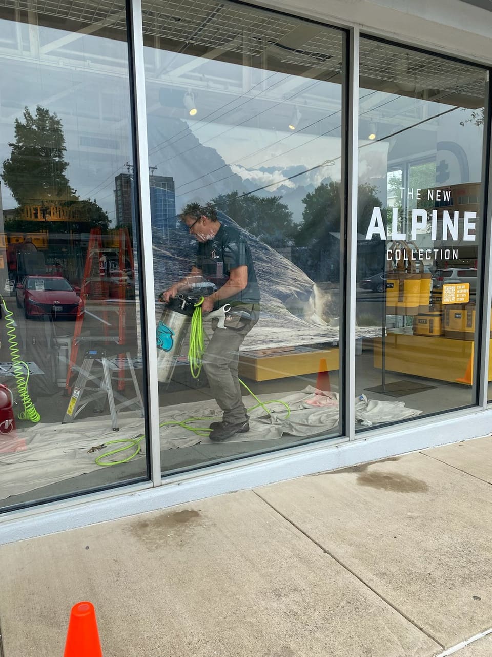 Epic Certified Installation Specialist filming a retail storefront window